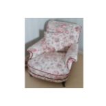 VICTORIAN UPHOLSTERED ARMCHAIR raised on turned legs to the fore 89 cm. wide; 115 cm. deep; 73 cm.