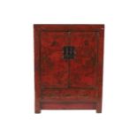 CHINESE PROVINCIAL LACQUERED CABINET the rectangular top above two panelled, figure and landscape