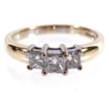 18 CT. YELLOW AND GOLD MOUNTED THREE STONE RING set with three princess cut diamonds weighing 1 ct.