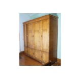 WILLIAM IV BIRDÕS EYE MAPLE WARDROBE the moulded crown above a series of four long doors, over
