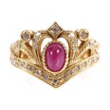 18 CT. YELLOW GOLD MOUNTED RING crown shaped with pave set diamonds and a cabochon ruby