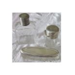 TWO SILVER MOUNTED PERFUME DECANTERS and silver topped oval shaped glass box