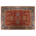 NORTHWEST PERSIAN CARPETon red ground, with all over pattern and blue border405 x 275 cm.