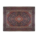 WEST PERSIAN KASHAN CARPETon navy ground, with red and ivory cartouches, and navy border290 x 410