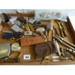 Military cigarette lighters, penknives, cigar cutters, caltrop, brass Baden Powell seal,