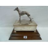 Silver presentation engine turned cigarette box with solid silver greyhound figure to top -