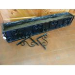 Wrought iron lined window box planter with support brackets