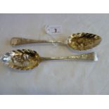 Pair silver berry table spoons with gilt bowls London 1820