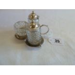 Silver topped cut glass cruet set on silver stand Birmingham 1901