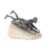 Bildhauer des 20. Jh. "Schlittenfahrer", Zinnguss, vollplastische Figur eines auf einem Bobschlitten