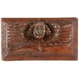 HOLZRELIEF MIT PUTTENKOPF17./18.Jh. Geschnitztes Hartholz. 37x21cmA WOOD RELIEF WITH HEAD OF A