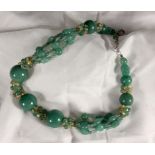 HALSKETTE AUS JADEPERLENmit Silberschließe. L.47cm A NECKLACE OF JADE BEADSwith silver clasp, 47cm