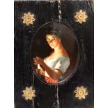 PORZELLANMINIATURum 1900 Junge Frau im Kerzenschein. Farbig auf ovaler Porzellanplatte gemalt.