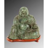 GLÜCKSBUDDHAChina Grün patinierte Bronze. H.16cm, Holzsockel. A LUCKY BUDDHAChina Green patinated