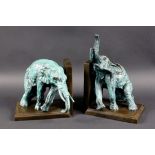 PAAR ELEFANTEN ALS BUCHSTÜTZEN2 patinierte Bronzefiguren. Bez.: Nick. H.27,5cm A PAIR OF ELEPHANTS