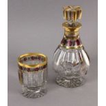 NACHTKARAFFE MIT FUSSBECHER Böhmen um 1900 Farbloses geschliffenes Glas mit Golddekor und