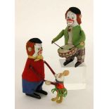 ZWEI SCHUCO TANZCLOWNS Schuco Patent Made in Germany Clown mit Affe und Clown mit Trommel.