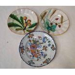 A pair of tin glazed Faience scallop rim plates, decorated in polychrome enamels depicting