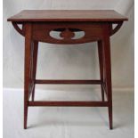 An Arts and Crafts oak side table of typical form with rectangular top, organic fretwork apron and