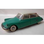 Gé Gé (France) a jade green and white plastic model Citroen DS19, battery powered friction motor,