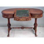 A Victorian burr walnut writing table, kidney shape top, carved edge, deep frieze housing three