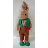 A Schuco Tricky Yes/No Rabbit, circa 1950, vintage childs toy with green waistcoat, brown