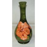 A Walter Moorcroft vase, circa mid 20th century, tubeline decorated in the Hibiscus pattern on a