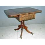 A Regency style mahogany pembroke table of small proportions, with twin flaps, above two drawers