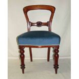 Six mahogany balloon back dining chairs with carved central splat, stuff over seats and ring