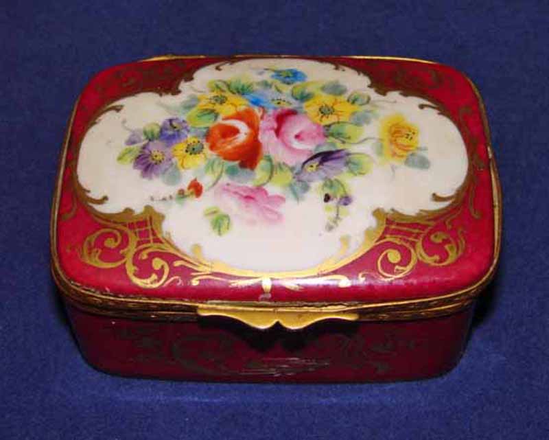 An early 20th century Sevres style French gilt metal mounted porcelain hinged box, hand painted with