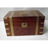 A mid 19th century rosewood and brass bound campaign writing slope, the hinged lid enclosing a