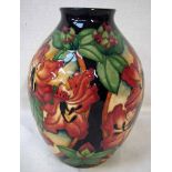 A modern Moorcroft pottery vase of ovoid form, tubeline decorated in Rhododendron design, date