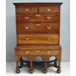 An 18th century chest on stand, the rectangular moulded top above two short and three long