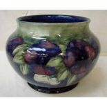 A large William Moorcroft jardiniere, tubeline decorated in the Pansy design on blue/green ground,
