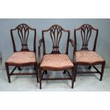 A set of seven Chippendale style dining chairs, late 19th/early 20th century, including an elbow