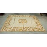 A 19th century silk bed throw with gold threaded floral borders and a central floral panel, 210cm by