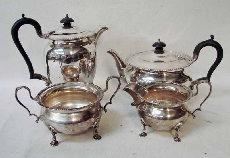 An early 20th century silver four-piece tea service of circular form with gadrooned rim, each