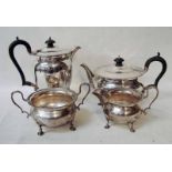 An early 20th century silver four-piece tea service of circular form with gadrooned rim, each