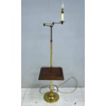 A good quality brass floor lamp, height adjustable with articulated three section swinging arm