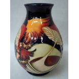 A modern Moorcroft pottery vase, tubeline decorated in the Parasol Dance pattern by Kerry Goodwin,