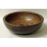 A 19th century turned elm bowl with footed base, 34cm diameter