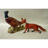 A Beswick Cock Pheasant, number 1225 and a Beswick large Standing Fox umber 1016A (2)