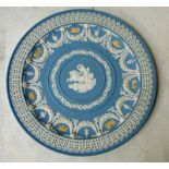 A Wedgwood tri-colour jasperware Trophy plate in pale blue with white and cane ornamentation to