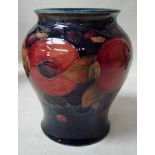 A Moorcroft pottery baluster vase, tubeline decorated in the Pomegranate design, blue signature