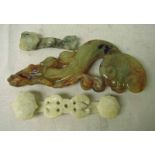 A collection of three Chinese carved jade Ruyi or love tokens, 11cm-24cm long (3)