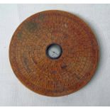 A Chinese lacquered wooden geomancers compass, circular with inset central silvered compass