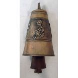 A Tibetan bronze prayer bell of tapering oval form, a band of cats and calligraphic text around