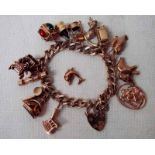 A 9ct gold charm bracelet with fourteen different charms, 75.8g total weight