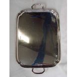 An early 20th century silver two-handled tray of rectangular form with double rounded corners,