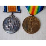 A 1914-1918 War Medal and a Victory Medal, 85210 GNR. E. TEMPERLEY. R.A. (2)